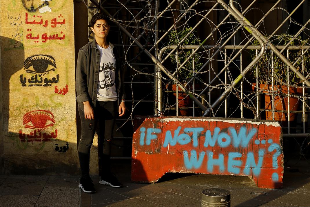 Rana, 32, standing in Riad El-Solh Square, one of the main protest sites in downtown Beirut. December 22, 2019. 