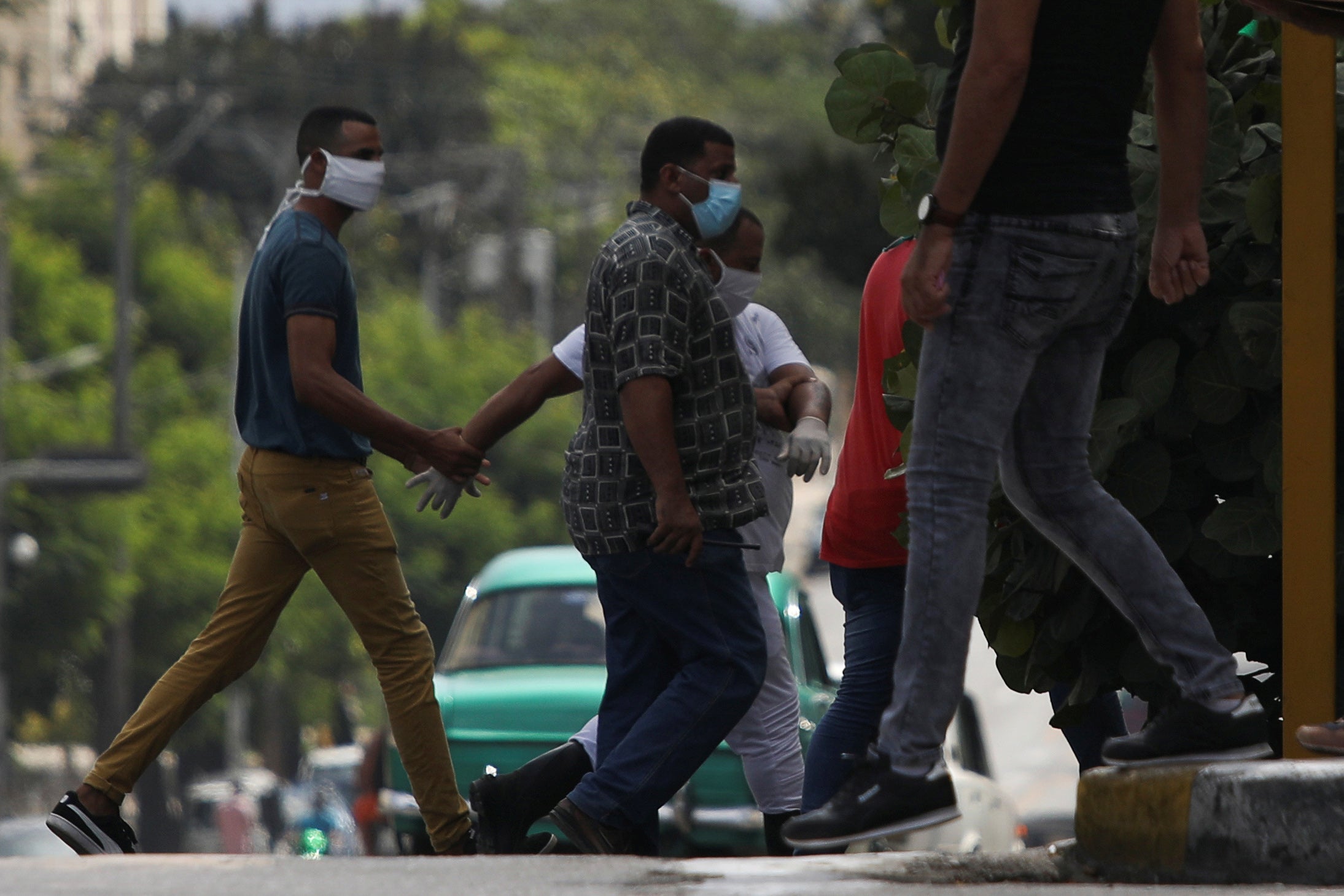 A man is detained at the site where a protest against the killing of a Black man by police was due to take place in Havana, Cuba, June 30, 2020.