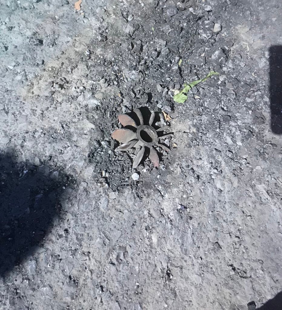 Tail fin from a mortar projectile that stuck the asphalt road in the main square of Humera town, Tigray region, Ethiopia in November 2020.