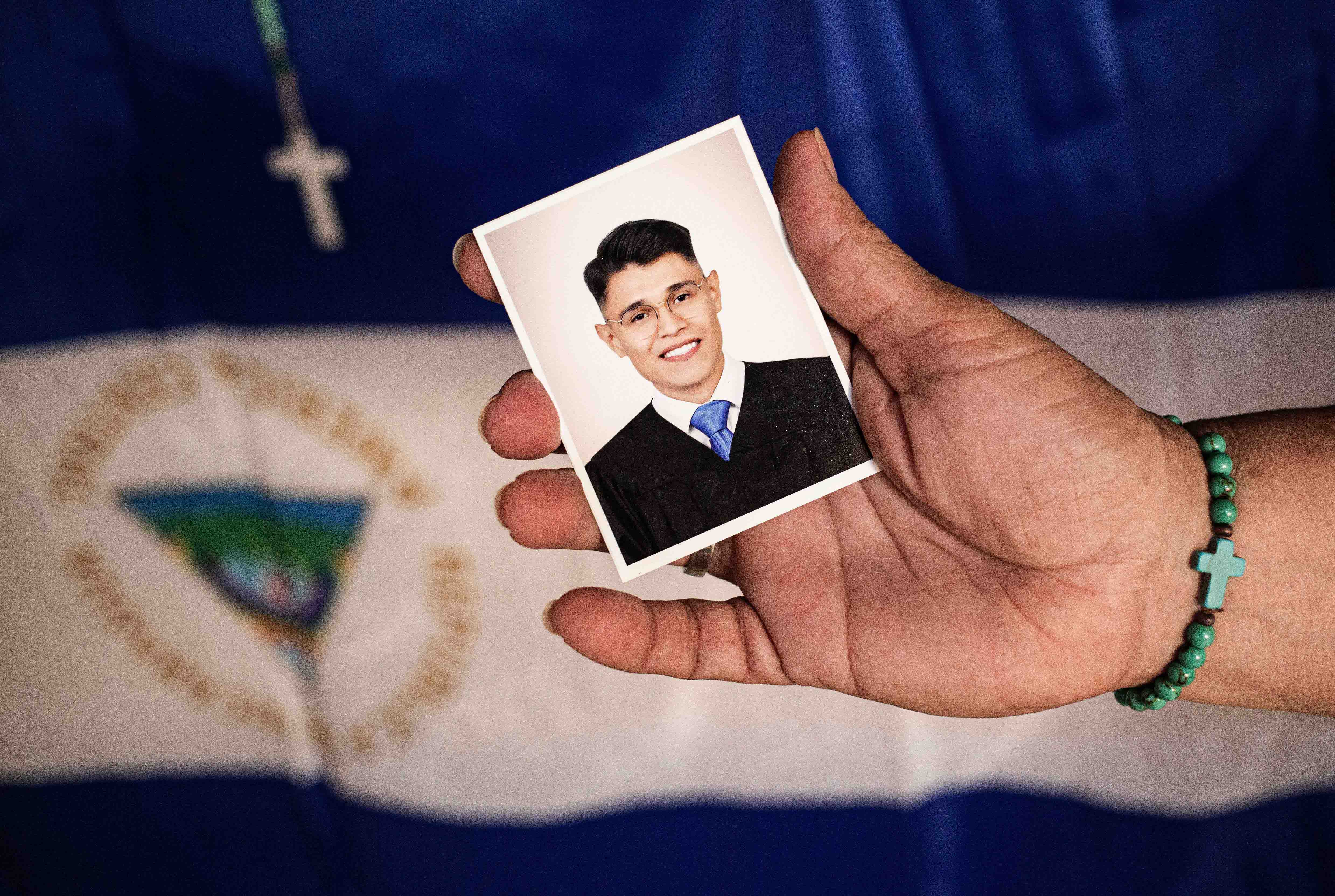 Lesbia Alfaro, mother of student leader Lester Alemán, who went into exile after participating in protests against Nicaraguan President Daniel Ortega's government in 2018, holds a portrait of her son during an interview with AFP in Managua, on September 14, 2021.