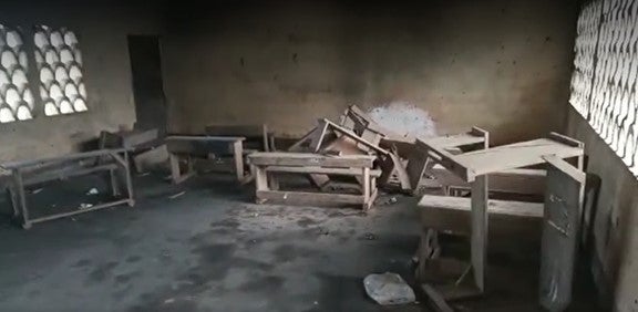 Desks in an abandoned classroom