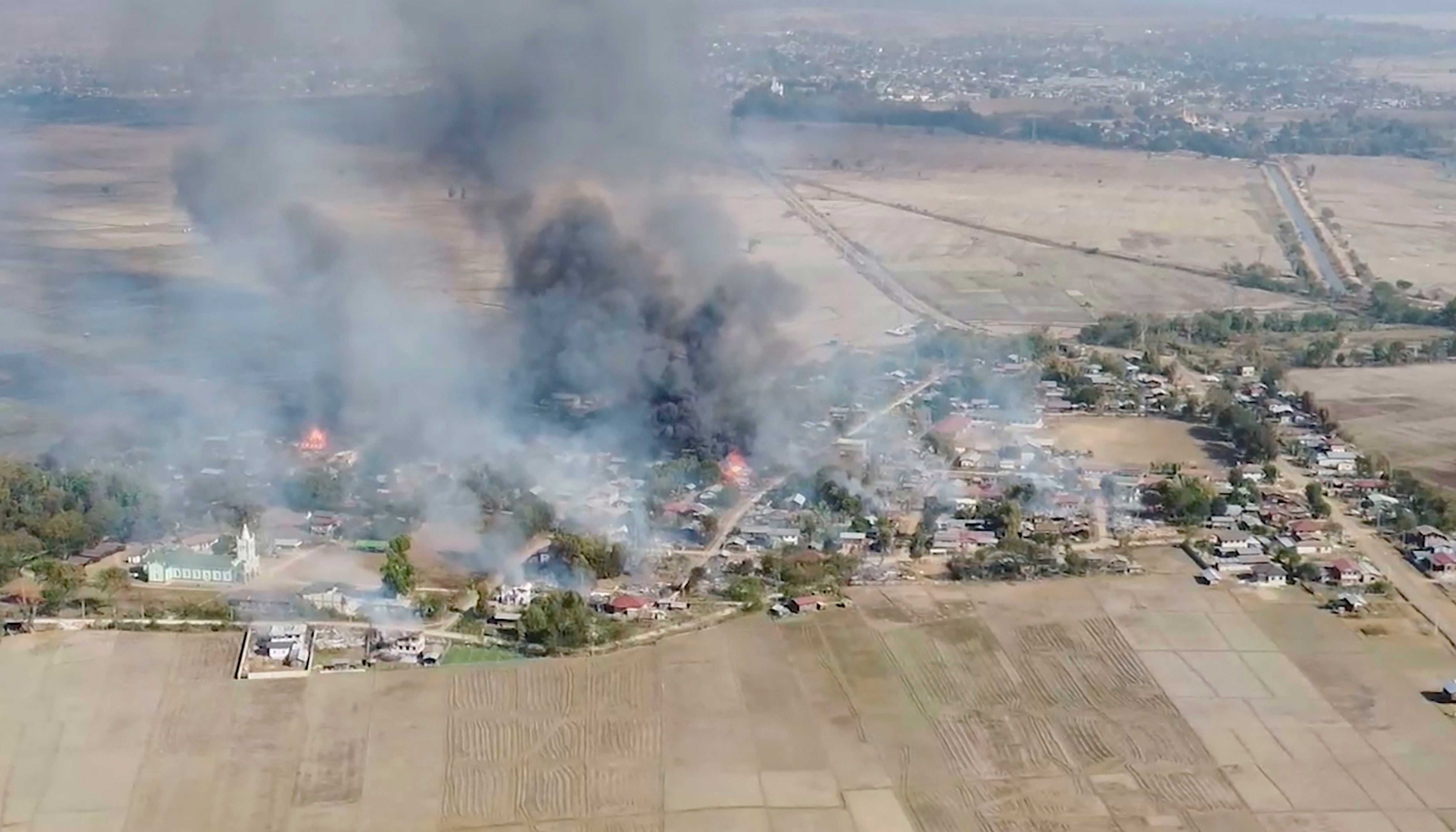 Smoke rises from burning buildings in Karenni (Kayah) State, Myanmar, February 18, 2022.