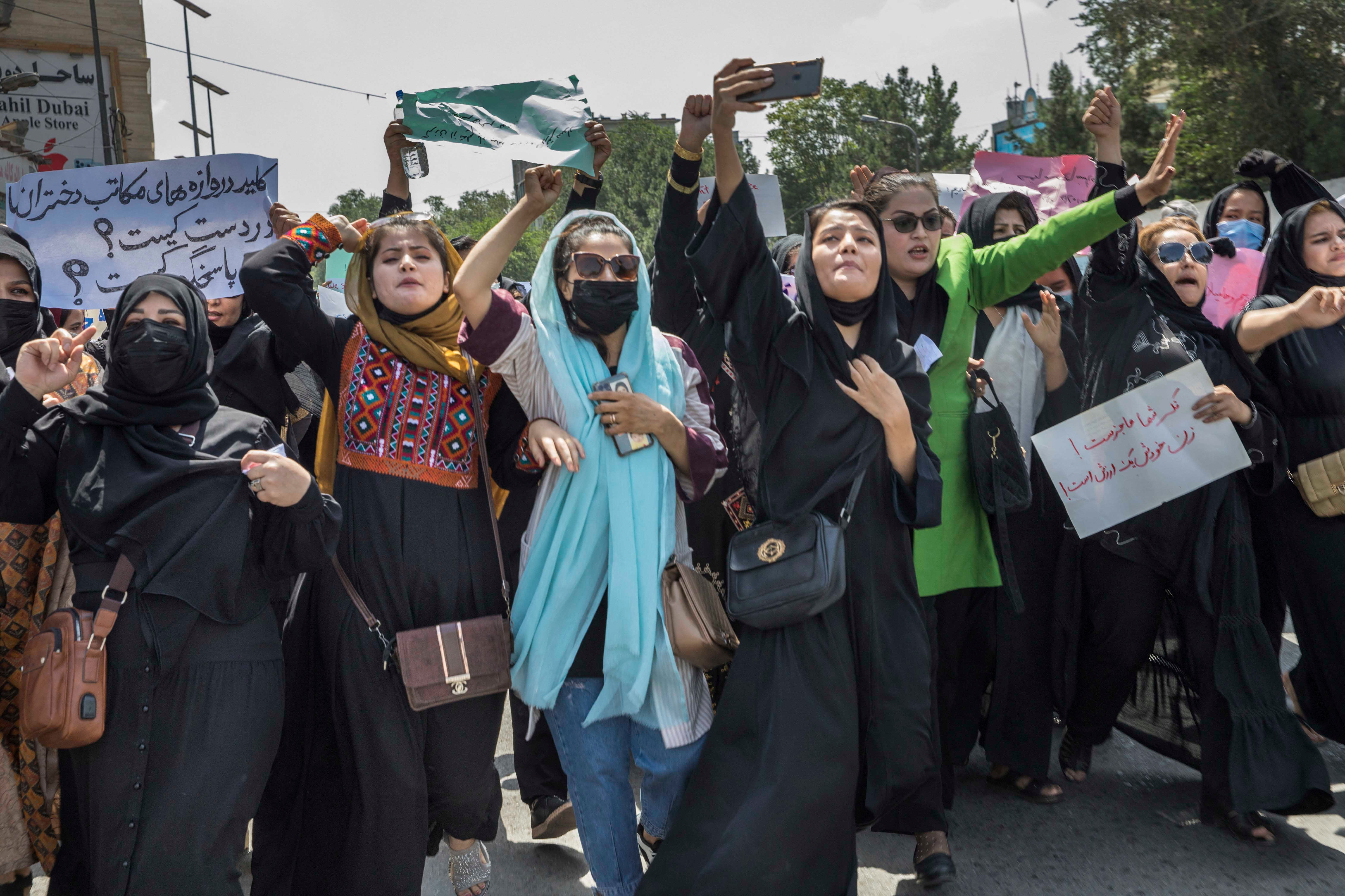 Afghan women demonstrate against violations of their rights in the center of Kabul, Afghanistan, August 13, 2022. 