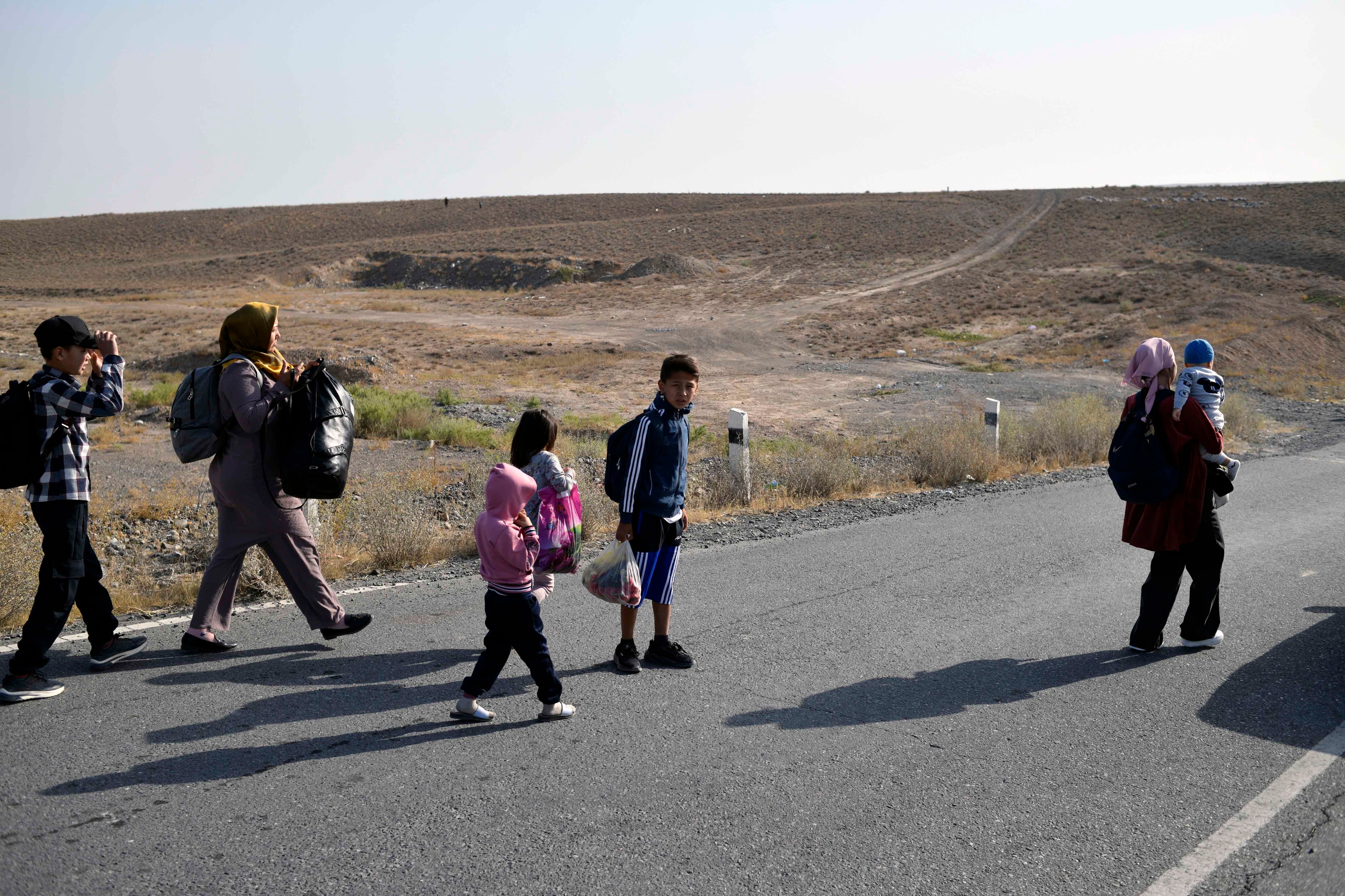 People walking along a road 