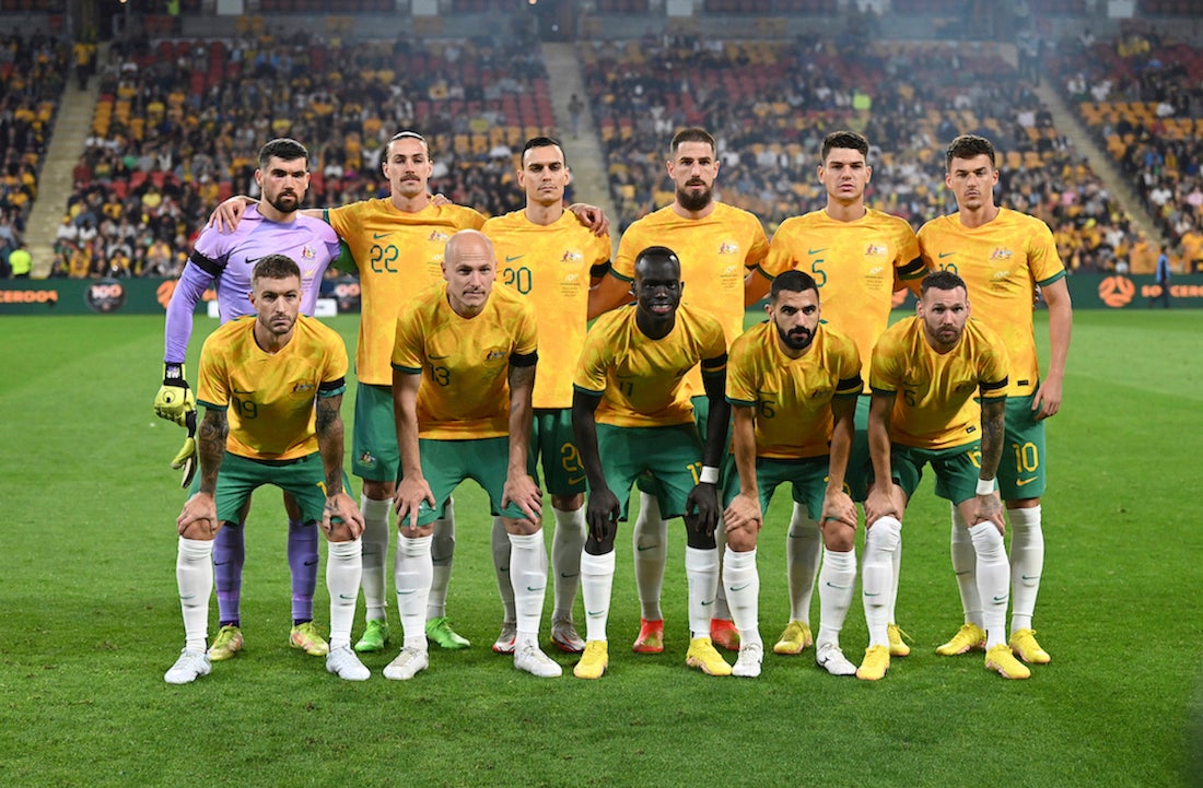 The Australian national soccer team, the Socceroos, pose for a photo before the start of a game in Brisbane, Australia.