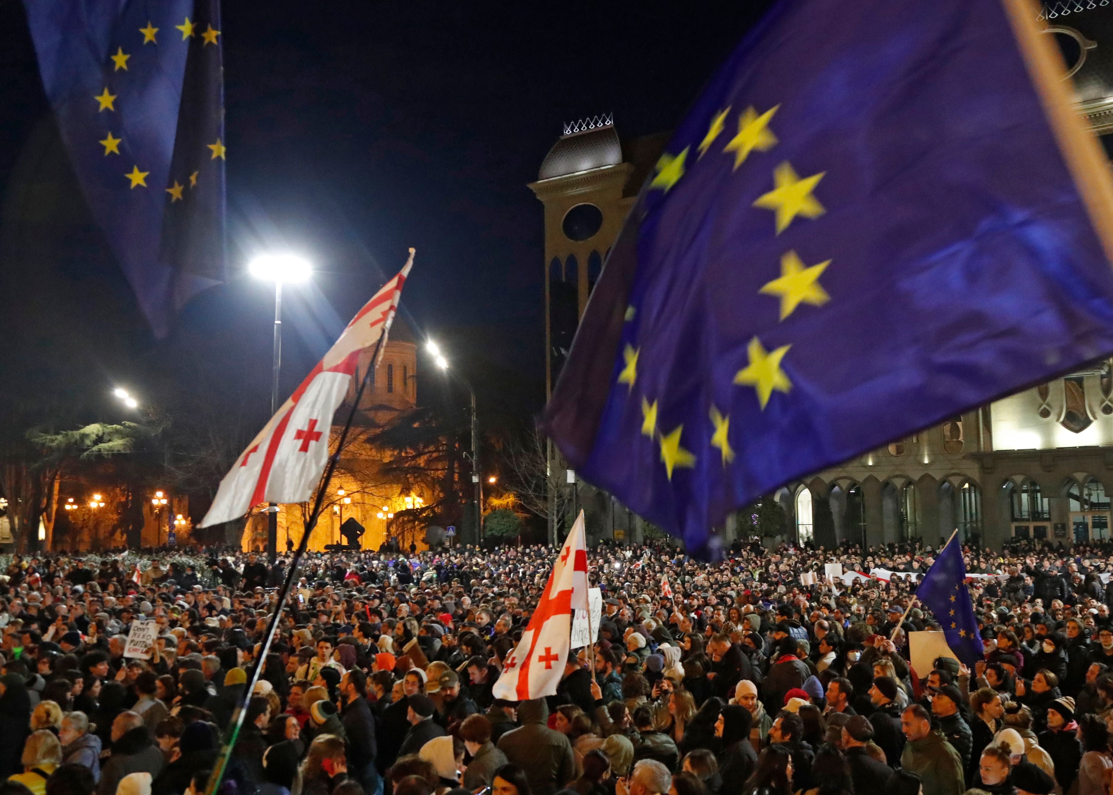 People take part in a rally to protest against the adoption of the so-called 'Foreign Agents Law' in front of Parliament building in Tbilisi.
