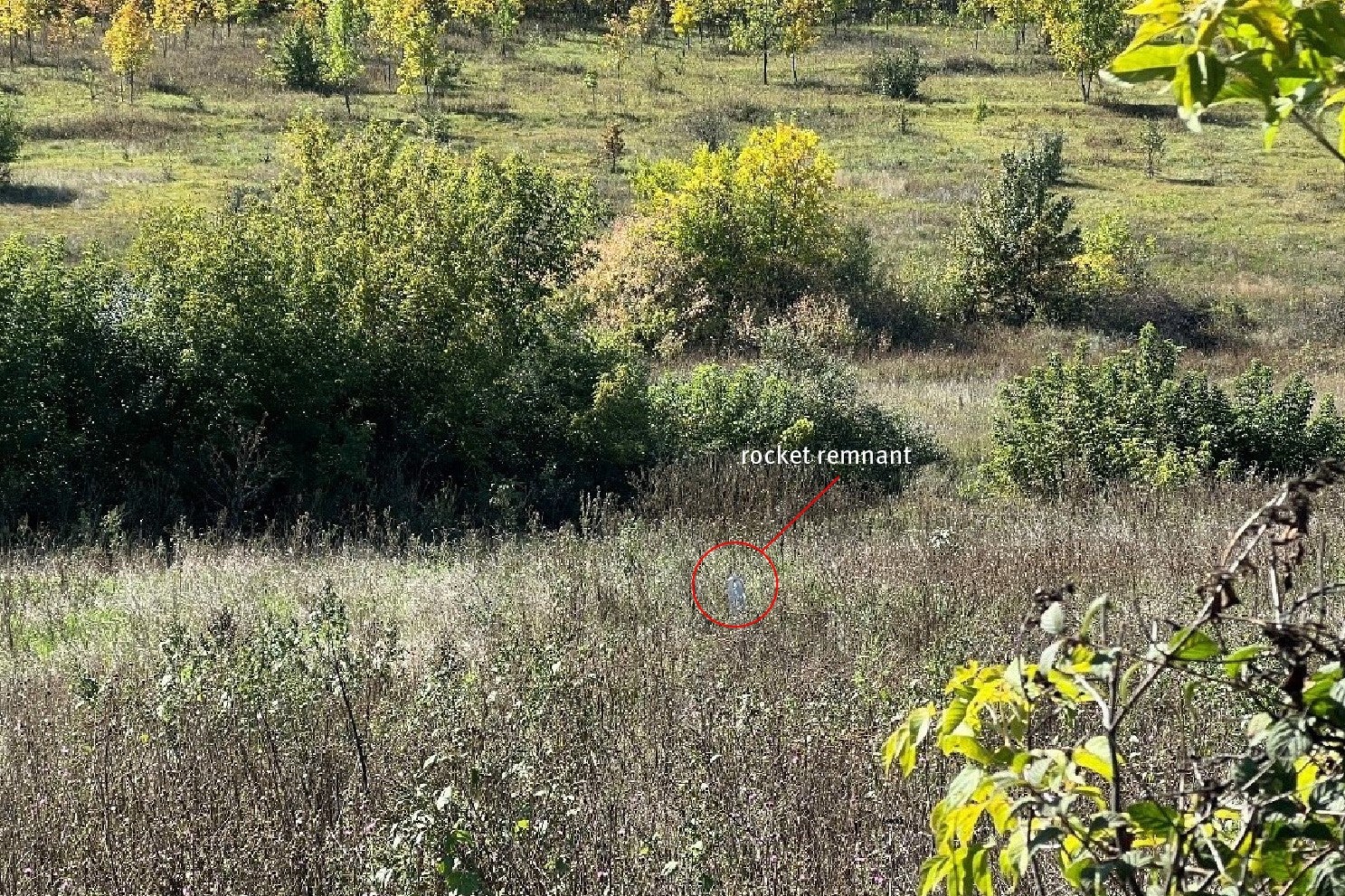 The carrier section of an 9M27K-series Uragan rocket lodged in the ground near a family’s home in Hlynske village, apparently fired from the west, where Ukrainian forces controlled territory while the area was under Russian occupation in 2022.  Each rocket delivers 30 9N210 or 9N235 submunitions.