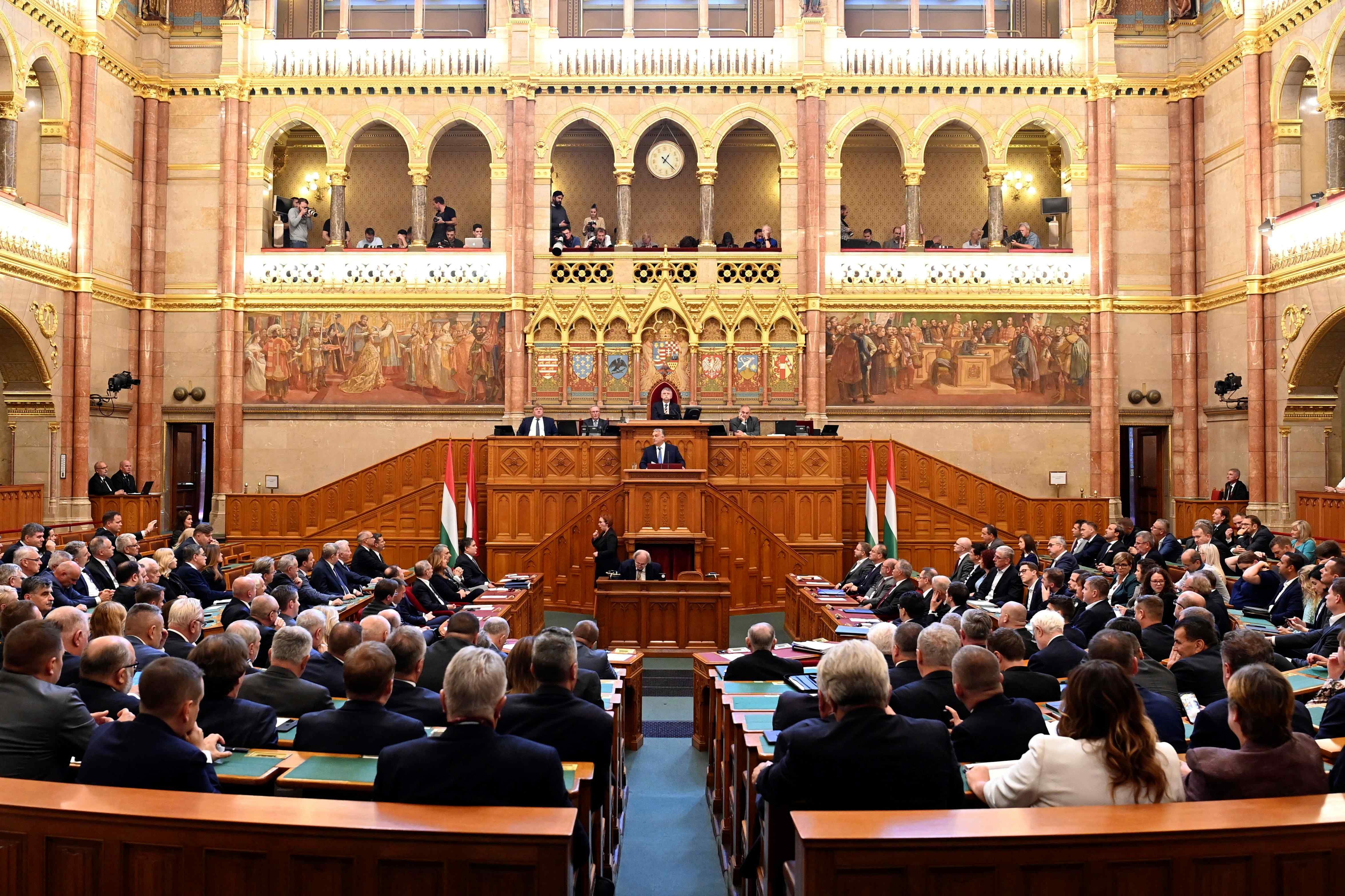 Hungarian Prime Minister Viktor Orban, center, delivers his address on the opening day of the parliament's autumn session 