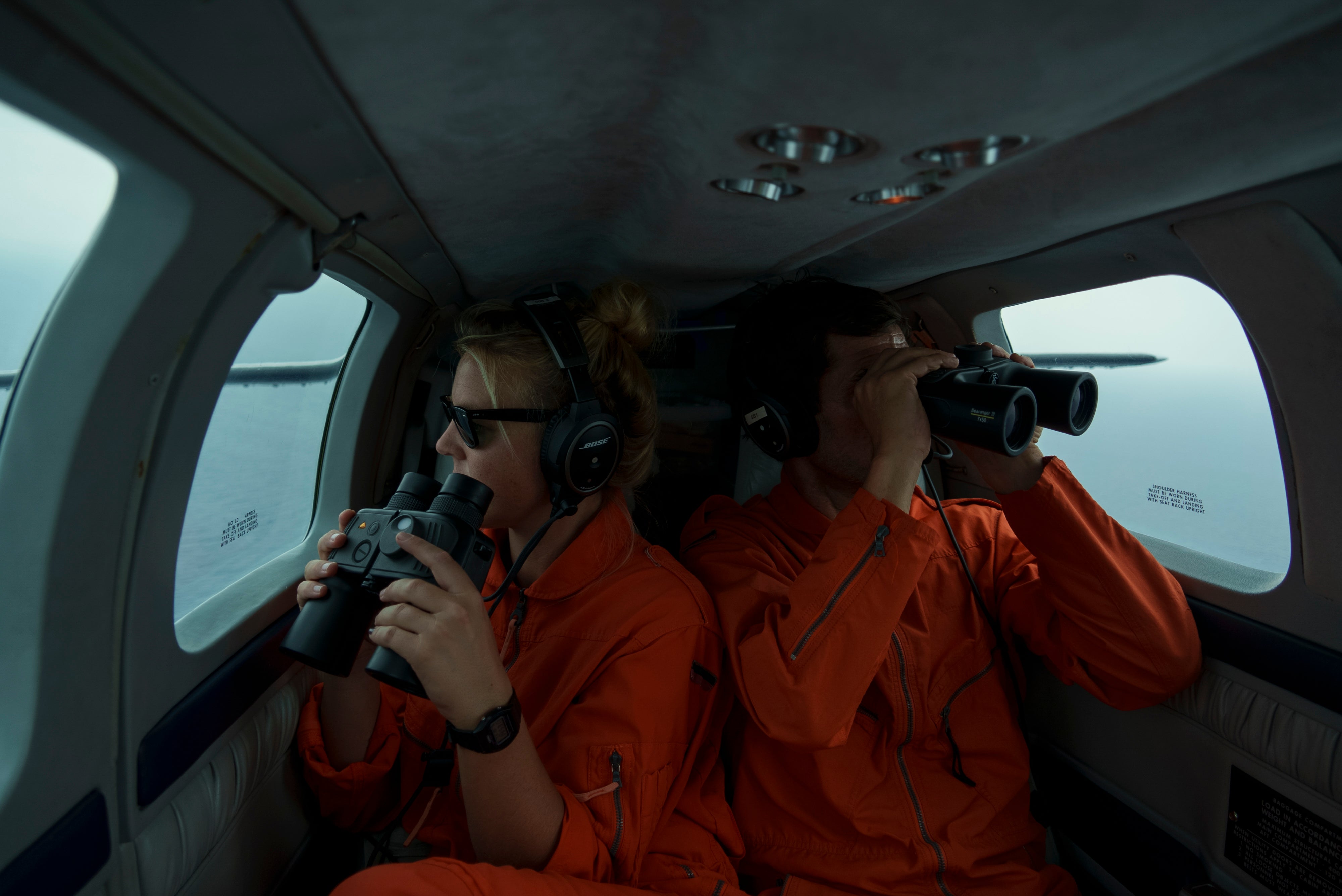 Volunteers aboard the Seabird, a plane operated by the rescue NGO Sea-Watch, look for boats in distress as they fly over the Mediterranean Sea between Libya and the Italian island of Lampedusa, October 5, 2021.