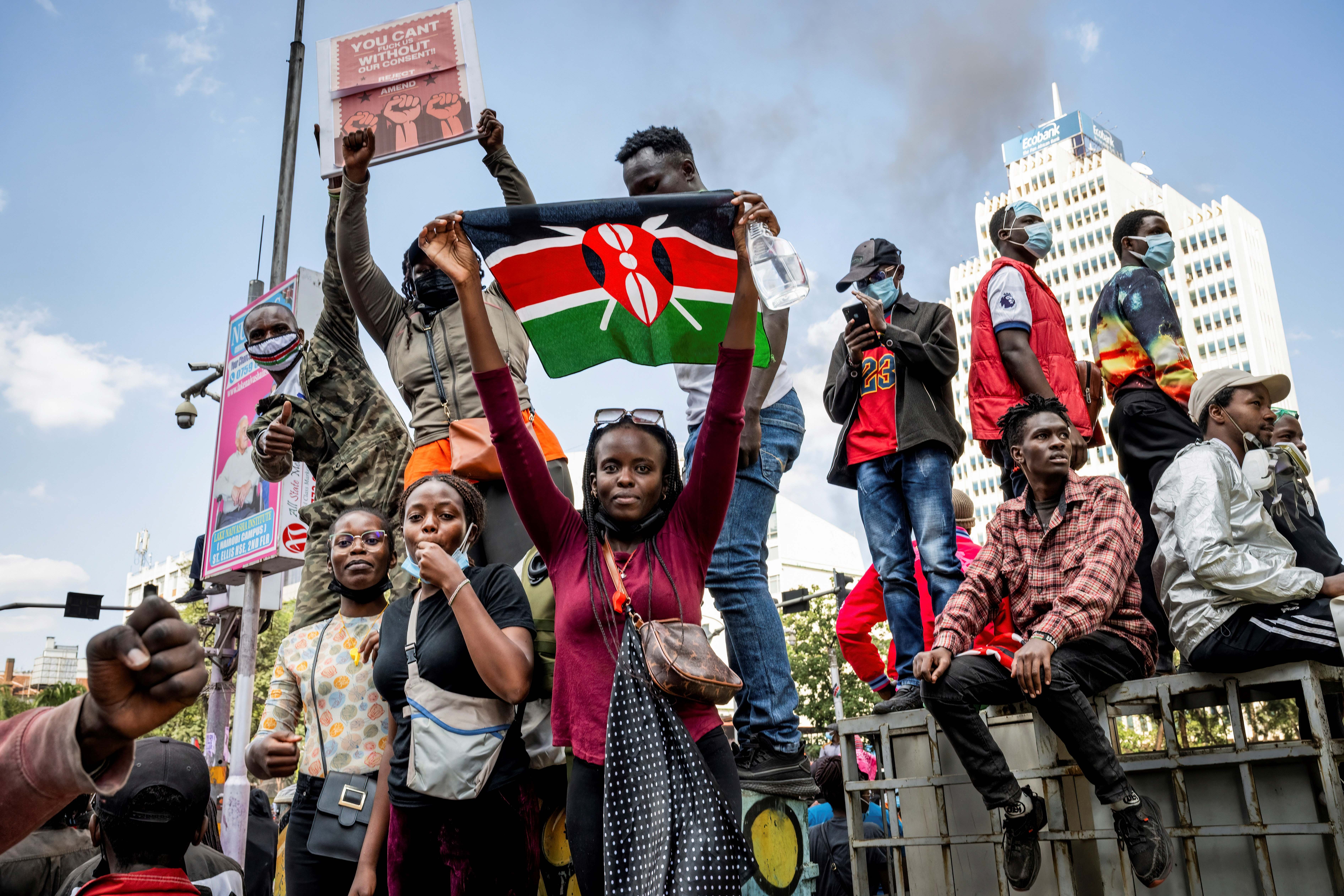 A protester holds a Kenyan flag during the nationwide demonstration against proposed legislation that would increase taxes across the country's economy, June 25, 2024. 