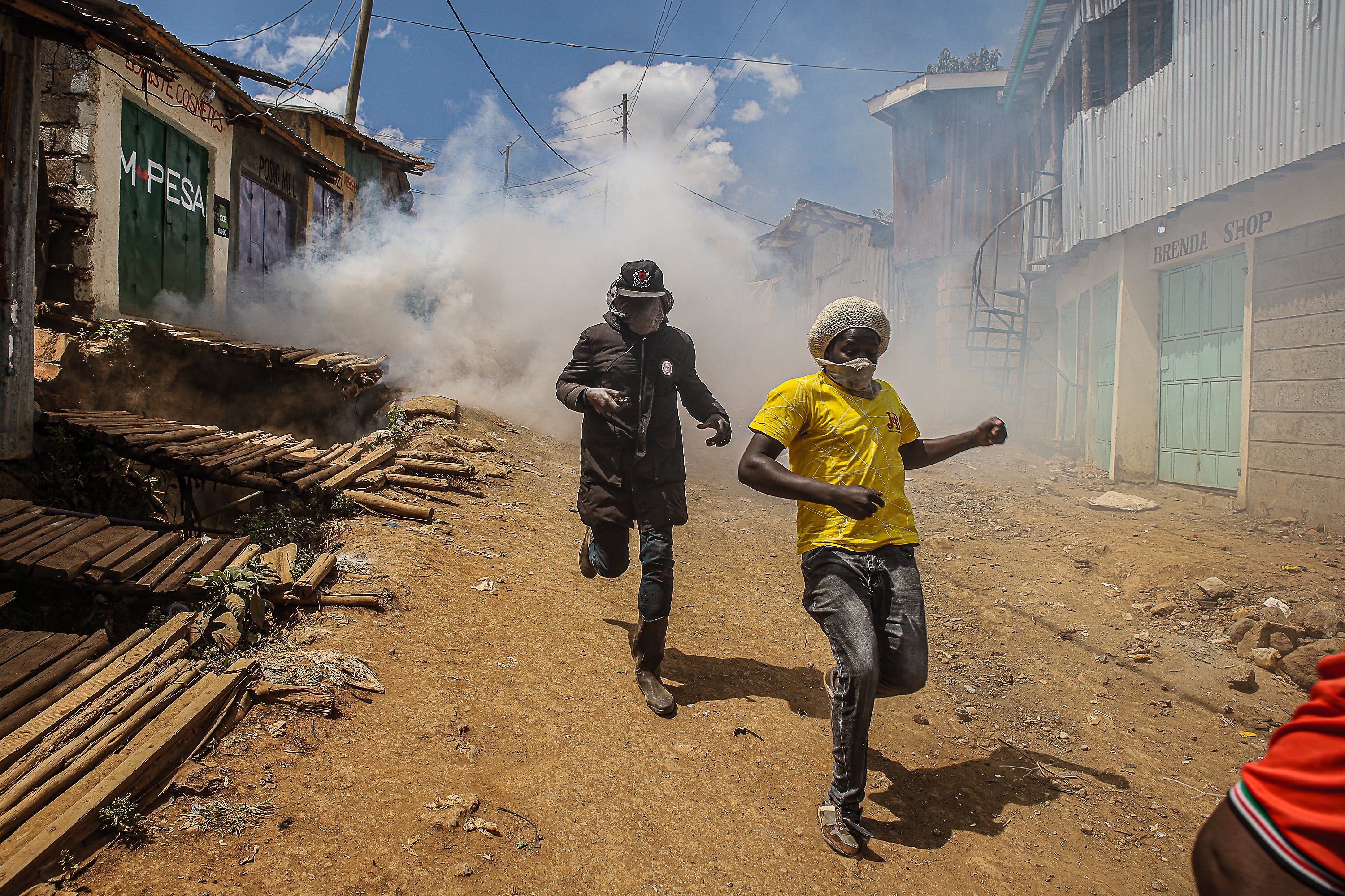 People run away from teargas