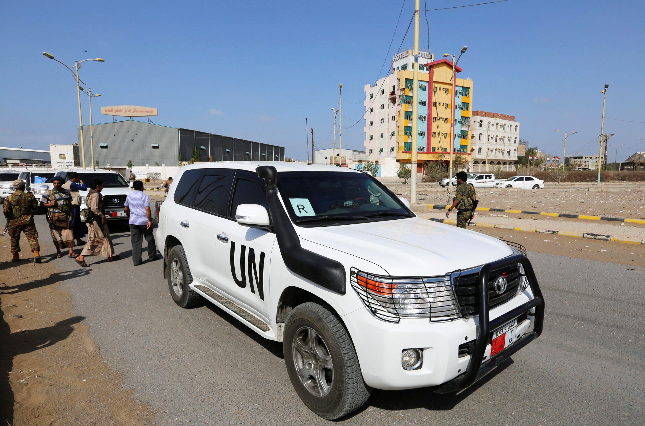 A convoy from the United Nations and World Food Program crosses from Houthi-controlled areas to a government-controlled area to reach grain mills in an eastern suburb of Hodeidah, Yemen, February 26, 2019. 