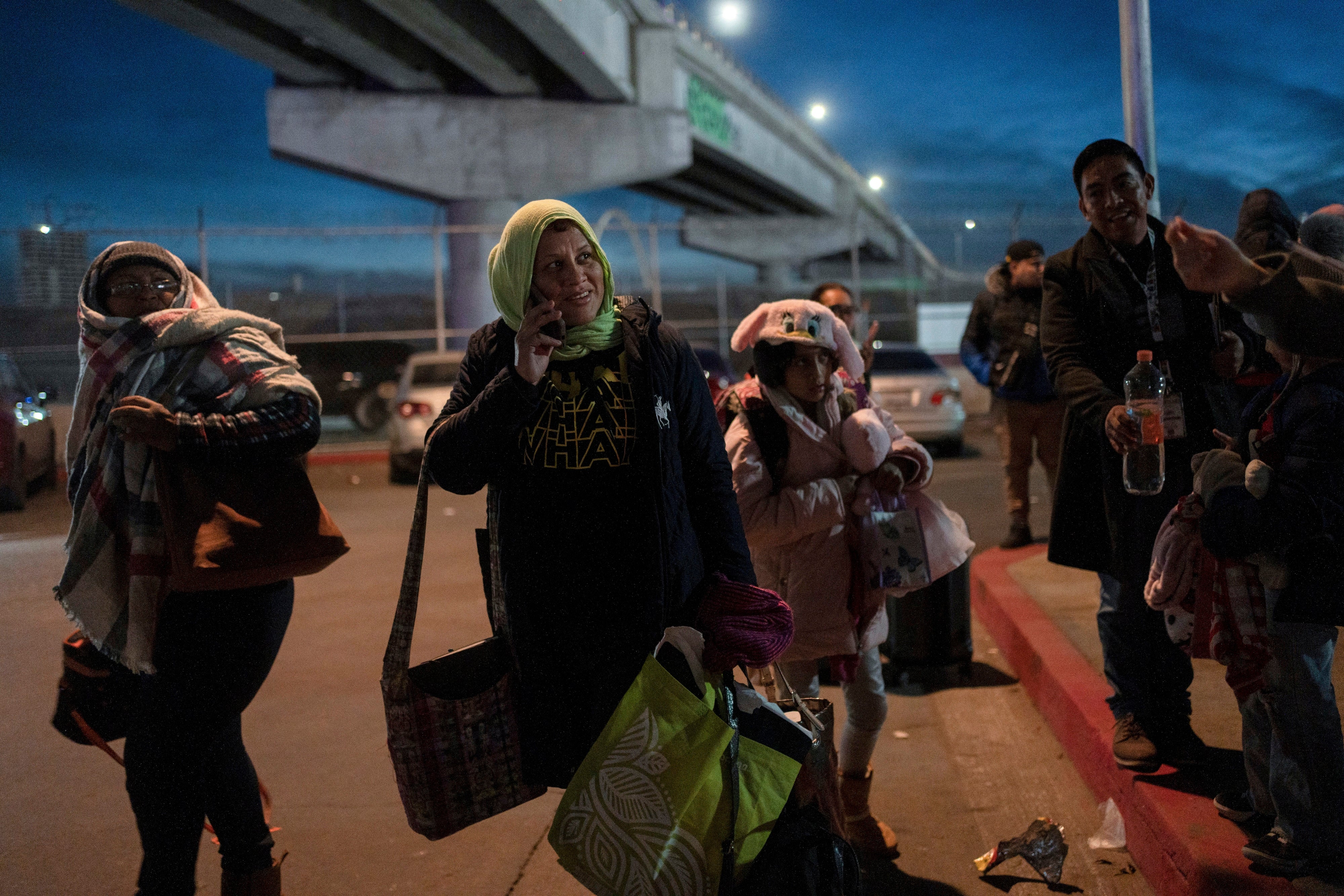 A group of migrants wait after learning that their appointments to apply for asylum in the US have been canceled.