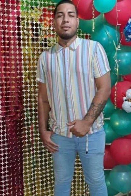 A young man posing for a photo