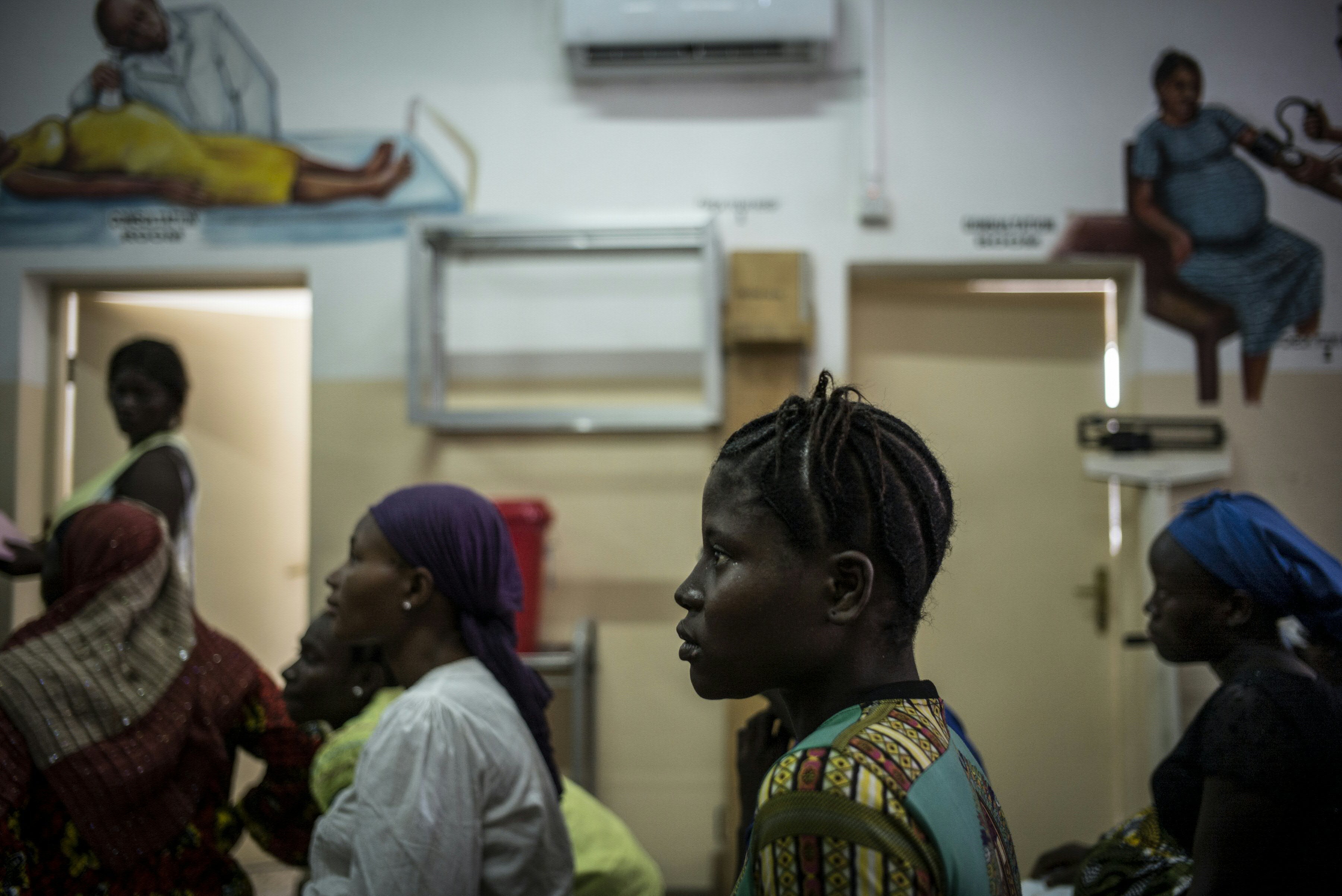 Pregnant women sit in the waiting area at the pre-natal clinic of the Princess Christian Maternity Hospital