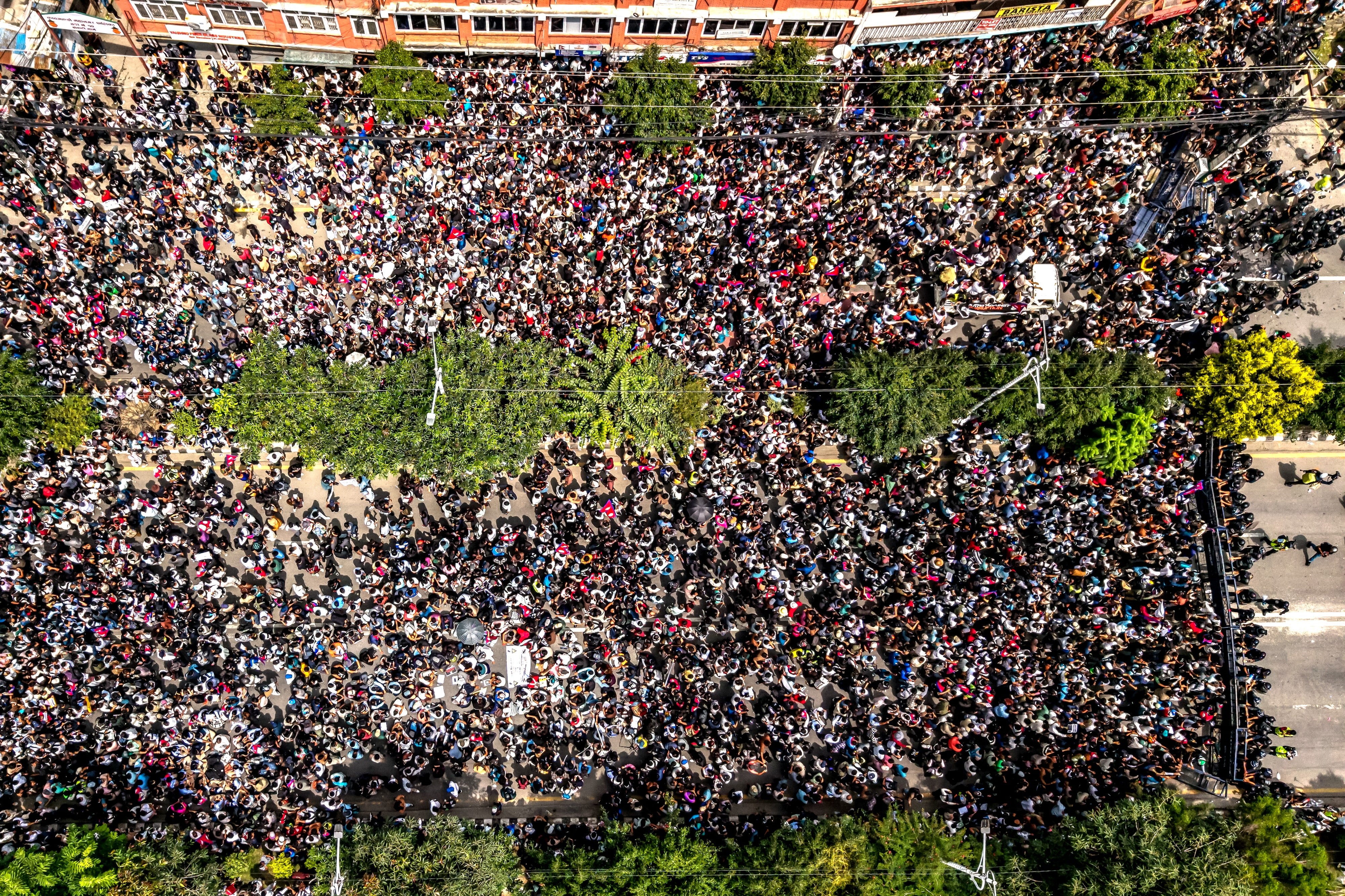 Demonstrators gathered outside Nepal's Parliament during a protest in Kathmandu on September 8, 2025, condemning social media prohibitions and corruption by the government.