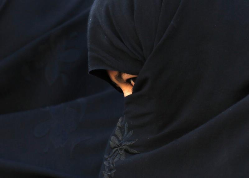 An Afghan woman in Chaghchran capital of Ghor province June 2, 2014.