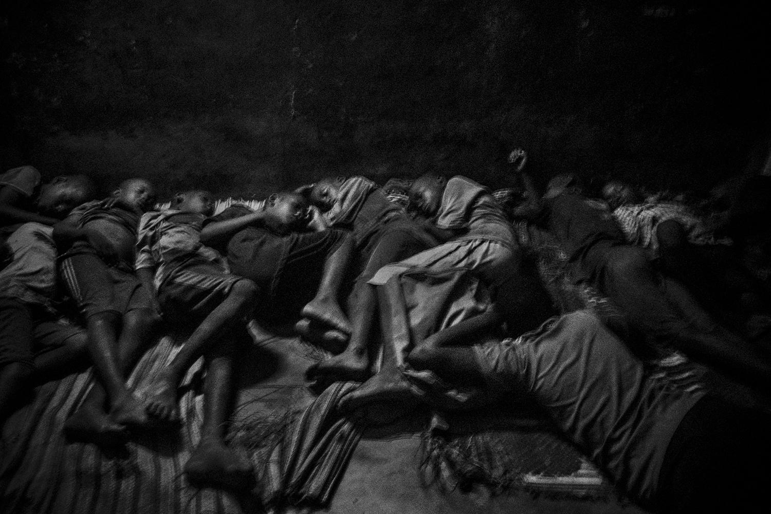 Talibés sleep together inside a traditional Quranic school in Saint-Louis, Senegal, in May 2015. 