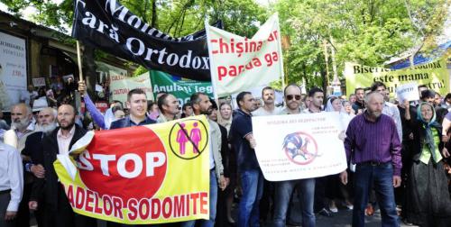 ©2016 Maxim Andreev for GENDERDOC-M. Demonstrators protest in opposition to an LGBT pride march held in Moldova in May 2016.