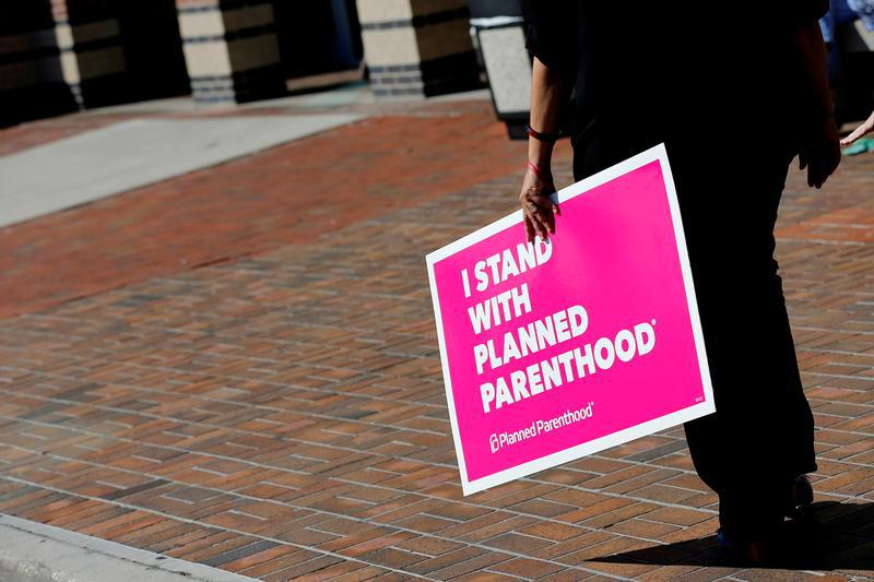 A sign in support of Planned Parenthood is seen outside a town hall meeting for Republican U.S. Senator Bill Cassidy in Metairie, Louisiana, U.S. February 22, 2017.