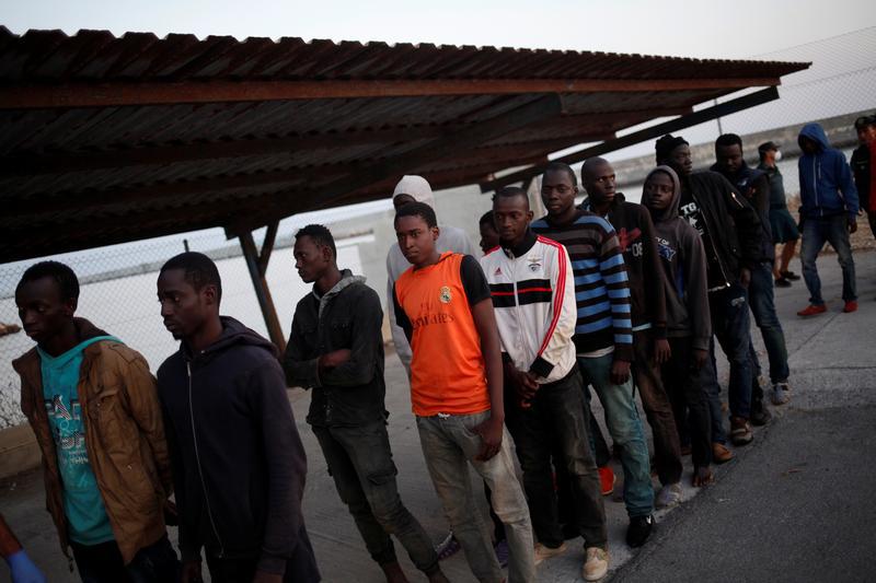 Migrants rescued from a dinghy off the Spanish coast wait to be screened by the Spanish Red Cross at the port in Motril, Spain July 23, 2017. © 2017 Reuters
