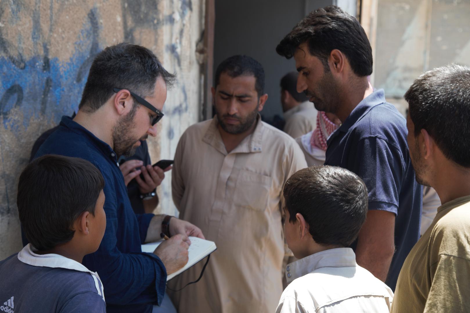 Author interviewing local Tabqa residents after ISIS had been pushed out of city (July 2017).