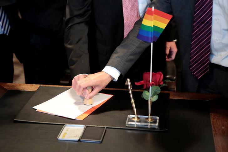 Same-sex couple get married at a registry office in Germany.