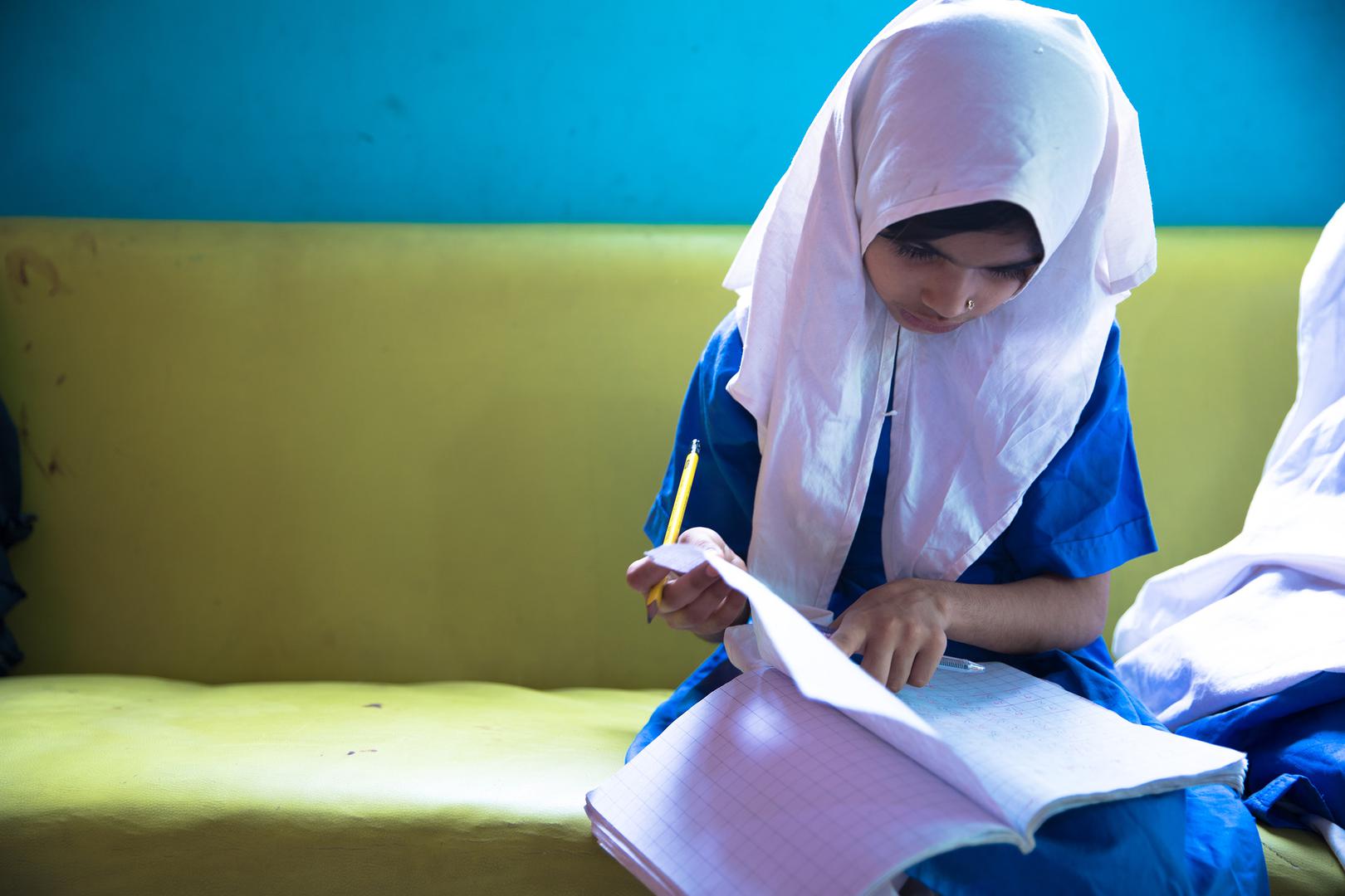 Laiba, age eight, a student at the lyari School. laiba’s older sister is not able to study at all because she is responsible for housework and caring for her younger siblings.