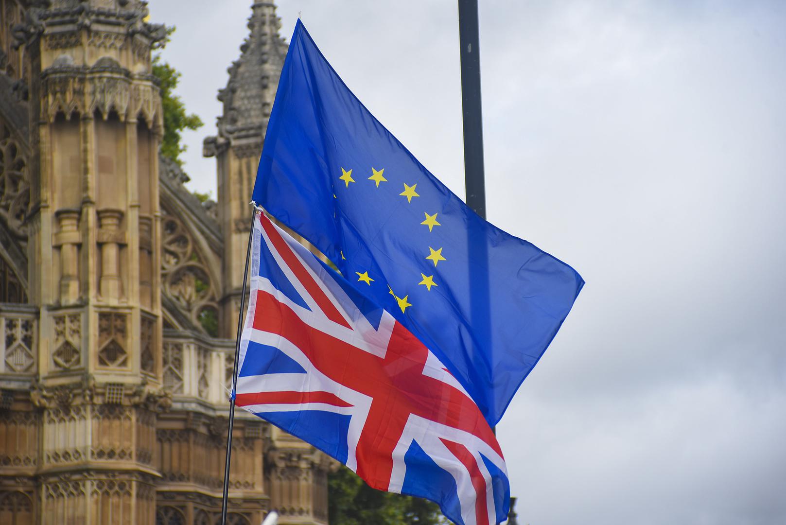 The EU and Union flags flying outside Parliament in Westminster, London. September 5, 2017.