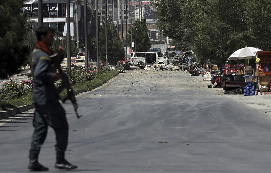 A security forces soldier arrives at the site of an explosion in Kabul, Afghanistan