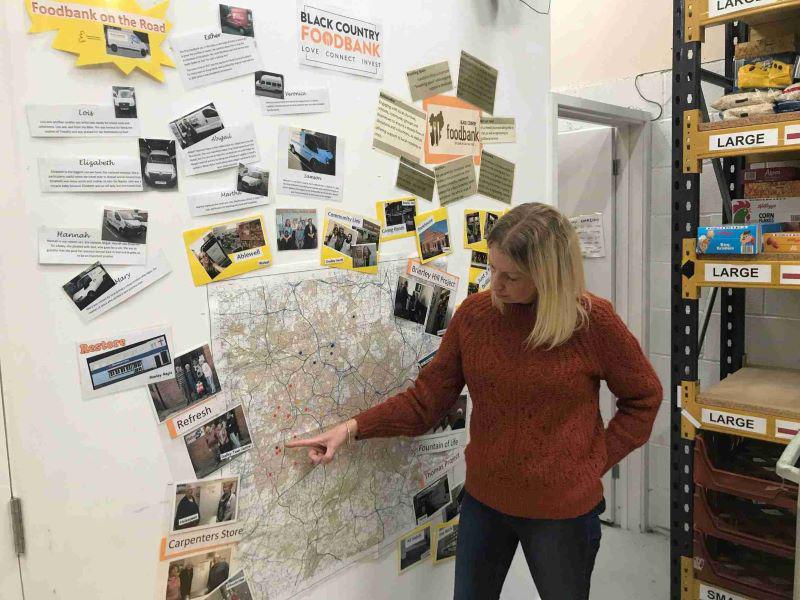 Jen Coleman, Office Manager at the Black Country Food Bank points out the locations of their 23 distribution centers across the West Midlands region where demand for food has increased by 35% this year and stocks are running low.