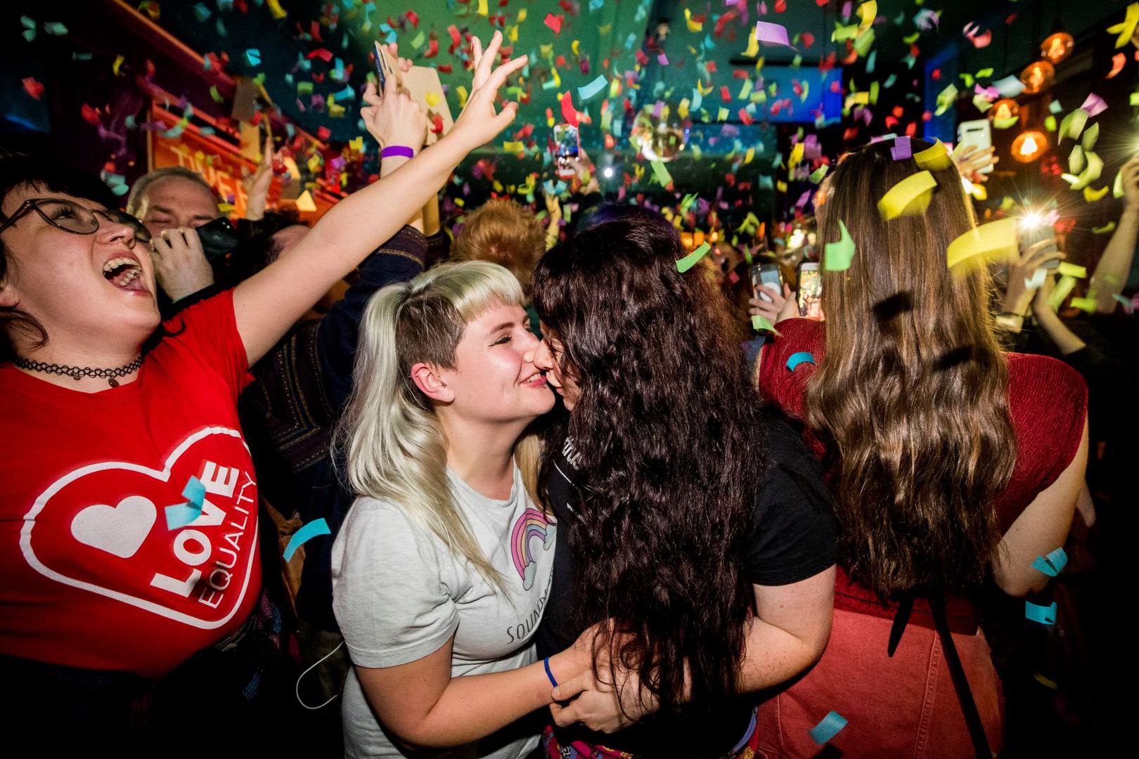 Equal marriage supporters at Maverick Bar, Belfast, celebrate the change to abortion and same sex marriage laws in Northern Ireland 