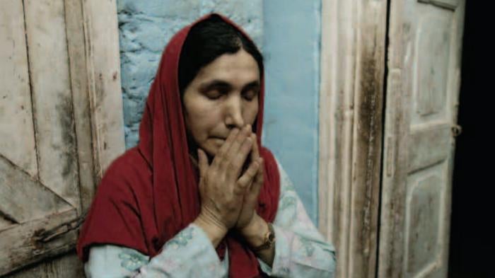 The mother of Bashir Ahmad Mir, Mahuda, cries while recalling her son who went missing in Bijbehara, Kashmir. Bashir joined an armed militant group in 1990 when he was fifteen years old and was arrested in 1994 by Indian security forces. He has never been seen again. 