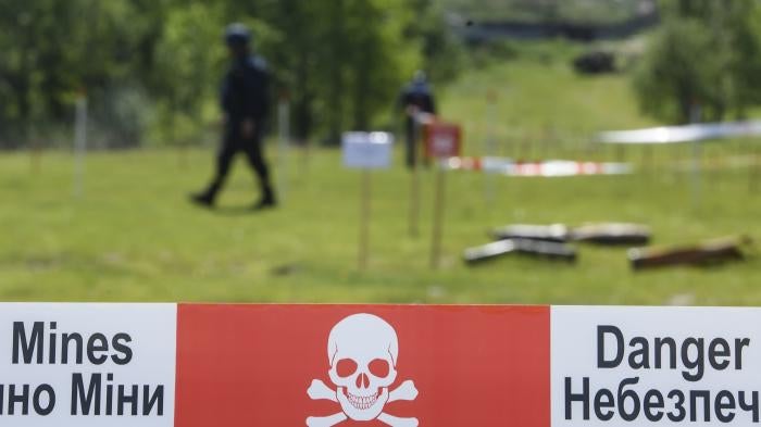 Members of a special demining unit of the State Emergency Service of Ukraine searching for landmines in Horenka, Kyiv oblast, May 27, 2022. 
