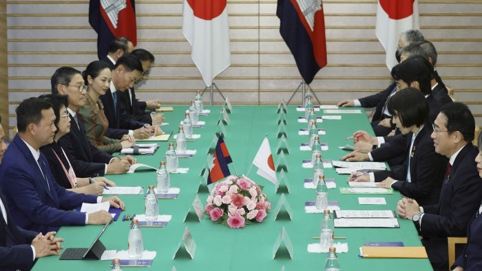 Japanese Prime Minister Fumio Kishida (R) and Cambodian Prime Minister Hun Manet meet at the prime minister's office in Tokyo on December 18, 2023.
