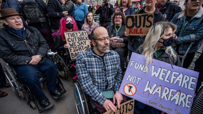 Disability rights activists gather to protest against cuts to social security outside Downing Street, London, UK, March 26, 2025.