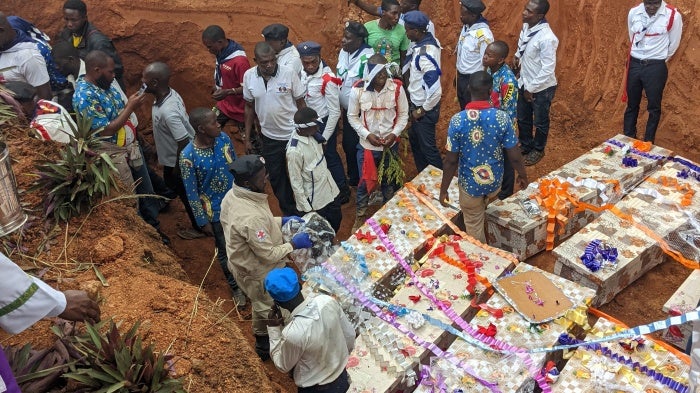 People gathered to bury those killed in an attack