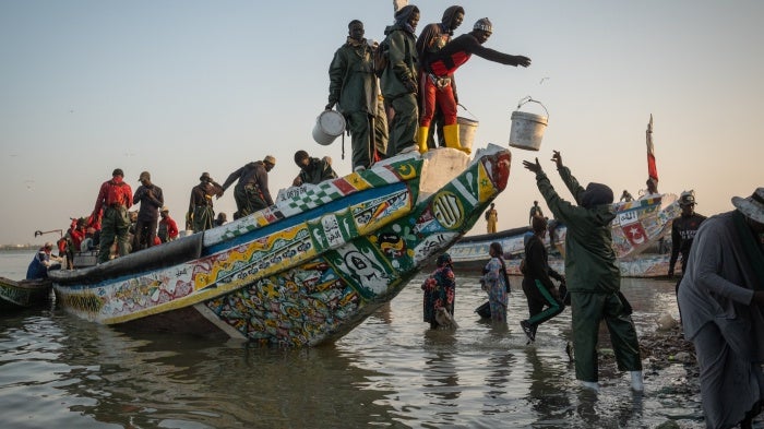 Fisherfolk working on a boat