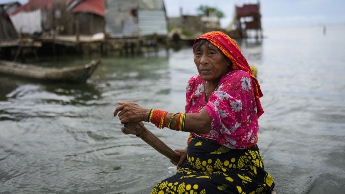 A person from the Guna Indigenous community along the shore of Gardi Sugdub Island, off Panama's Caribbean coast.