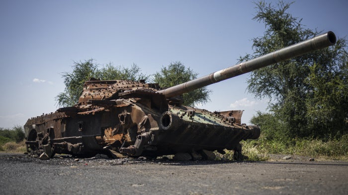 A charred T-72 tank lay on the road that connects Shiraro to Shire in Ethiopia's Tigray region, October 12, 2024. 