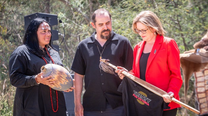 First Peoples Assembly co-chairs Ngarra Murray, left, and Ruben Berg, center, exchange gifts with Victorian Premier Jacinta Allan during the Ceremonial Opening of Treaty Negotiations on Wurundjeri Woi-wurrung country at Darebin Parklands, Victoria, Australia, November 21, 2024. 