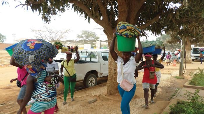 Street traders fleeing a police roundup in Viana, Luanda, September 15, 2013. 