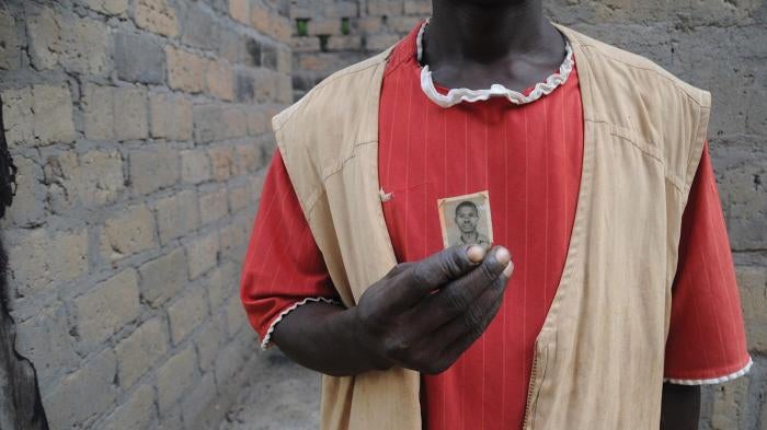 Resident of Ndanika holding a photo of his father who died in the bush after fleeing the Seleka on April 14, 2013. 