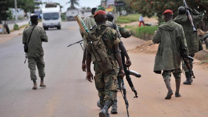 Soldiers from the Republican Forces of Côte d’Ivoire patrol the streets of Dabou on August 16, 2012, after attacks the previous night on the town’s military base and prison. 