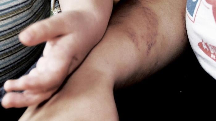 A woman and child at a shelter for victims of domestic violence in Hungary, October 10, 2013.