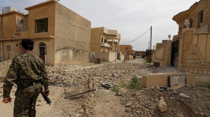 rubble-strewn street in Tikrit