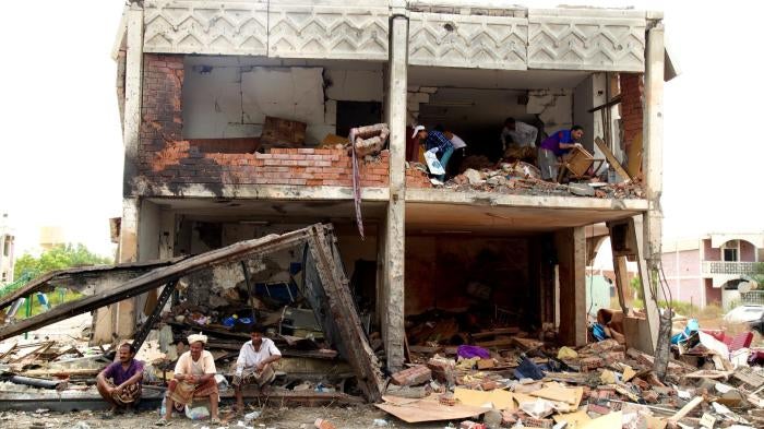 yemen cover bombed building