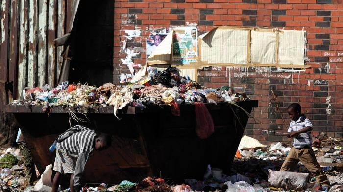 Children play in a refuse dumb in Harare, Zimbabwe's capital.