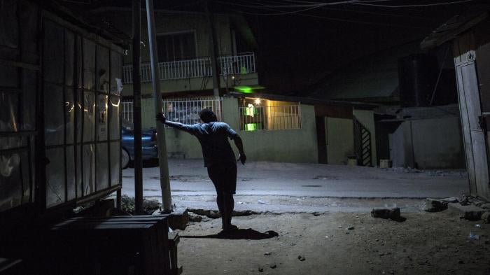 A gay man in Bariga, a neighborhood in Lagos, Nigeria, who said he hides his identity from his friends and family.