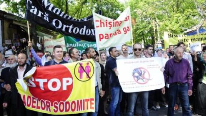 ©2016 Maxim Andreev for GENDERDOC-M. Demonstrators protest in opposition to an LGBT pride march held in Moldova in May 2016.
